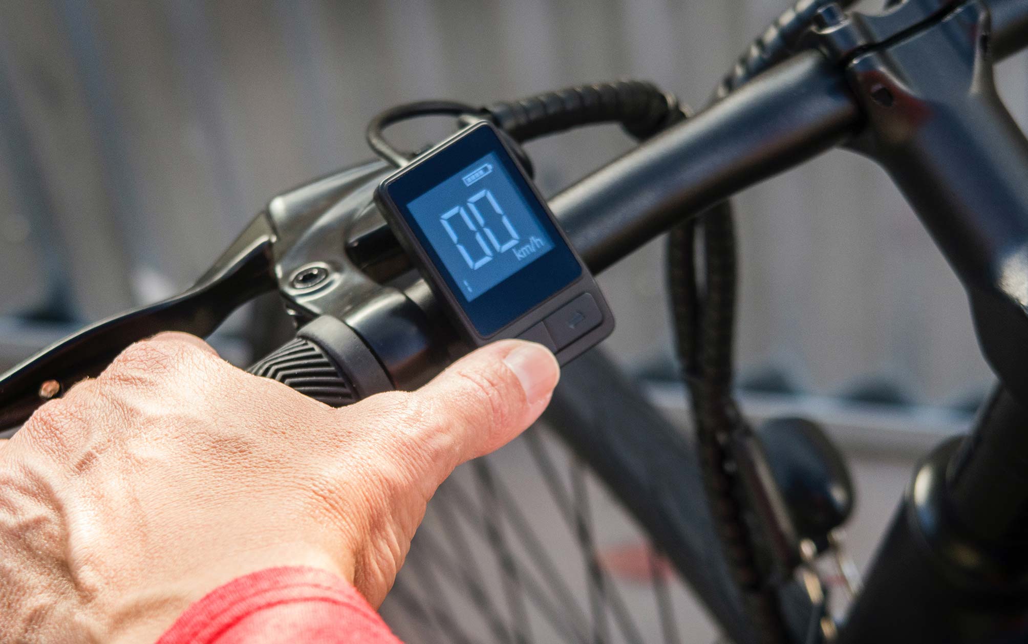 Man Holding Electric Bike Handlebar Man Holding Electric Bike Handlebar